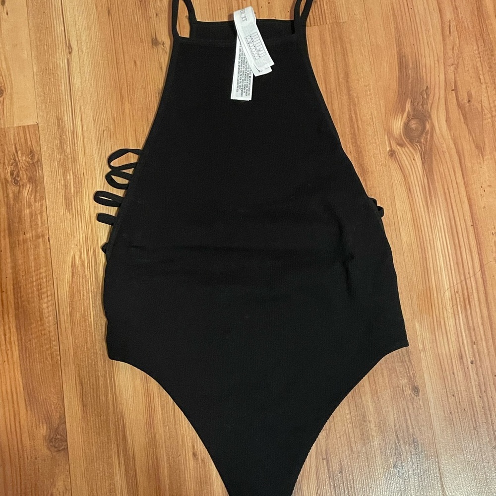black body suit, open sides
